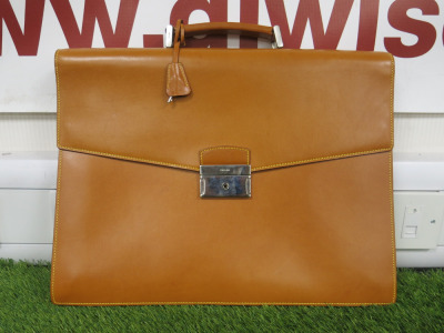 Prada Tanned Leather Briefcase. Size H33cm & W43cm. NOTE: missing key, condition as viewed/inspected.