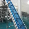 Infeed Step Rising Conveyor (Approx 9' Rise). Fitted Loose Product (Grated Cheese) Belt