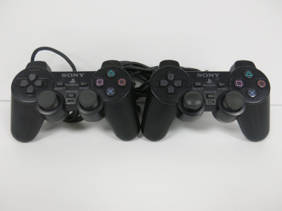 2 x Standard Black SONY PS2 Pads.