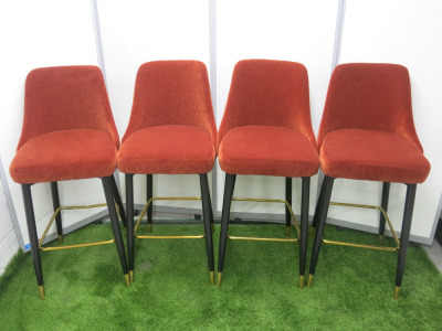 Set of 4 Modern Bar Stools Upholstered in Terracotta Velvet Fabric on Black Frame Wooden Legs with Gold Metal Foot Rest. Size H107cm.
