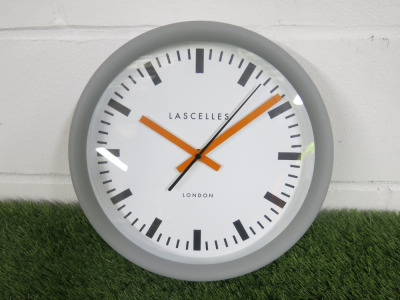 Lascelles Sync Grey Station Wall Clock with Orange Hands.