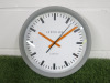 Lascelles Sync Grey Station Wall Clock with Orange Hands.