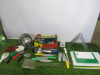 Quantity of Kitchen Utensils to Include: 6 x Spatulas, 2 x Scrapers,3 x Pizza Cutters, 7 x Ladles, 2 x Sieves, 29 x Assorted Sized Tongs, 1 x Salter Dietary Kitchen Scales, 6 x Kitchen Knives & 1 x Metal Chopping Board Holder & 5 x Assorted Chopping Board