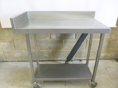 Stainless Steel Table on Castors with Part Splash Back & Shelf Under. Size H90 x W95 x D50cm.