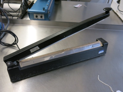 A/F- APC Impulse Sealer, S/N 128662.