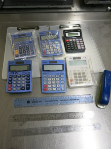 Assorted Stationery to Include: 2 x Clipboards, 6 x Calculators & 4 x Rulers.
