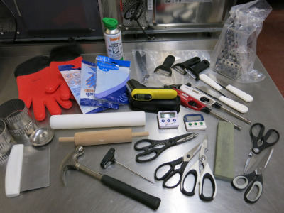 Assortment of Commercial Catering Utensils & Accessories to Include: Peelers, Graters, Spatulas, Thermometers, Sharpeners, Temperature Gun, Rolling Pin, Scissors, Lighters etc. (As Viewed).