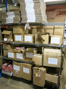 Wire Rack Containing Large Quantity of Boxed Crockery to Include: Red Share Plates, White Share Plates, Soya Dishes, Square Japan Plates, Glassware Etc (As Viewed).