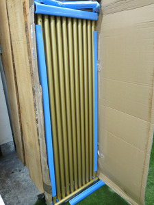 Boxed/New Terma Rolo Radiator in Brass. Size H180cm x W60cm.