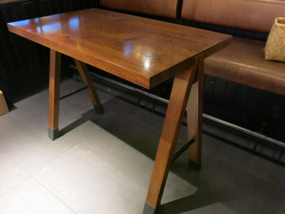 Dark Wood Varnished High Table with Metal Feet Caps. Size H90 x W110 x D65cm.