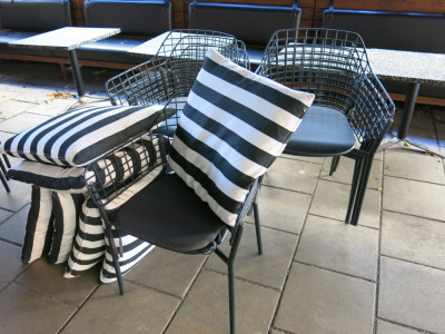 8 x Emu Outdoor Black Metal Wire Armchairs with 8 x Plain Padded Seat Cushions & 8 x Black & White Striped Cushions. Size 55 x 55cm.