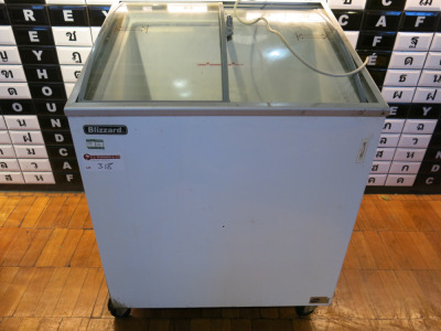 Blizzard Curved Glass Top, 2 Sliding Doors Ice Cream Freezer on Castors, Model IC7. Size H95 x W72 x D63cm. NOTE: unable to power up for spares or repair.