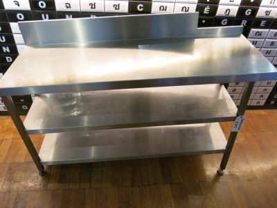 Stainless Steel Table with 2 Shelves Under. Size H87 to 73 x W140 x D49cm. NOTE: difference in height