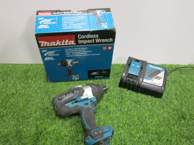 Makita Cordless Impact Wrench, Model DTW1001Z, 18v. Comes in Original Box with Makita DC18RC Single Charger. NOTE: batteries required.
