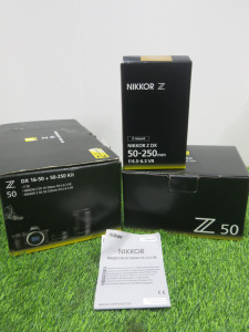 Boxed/New Appears Unused Nikon Z50 Digital Camera, S/N 6108811. Comes with Canon DX 16-50 Lens, S/N20630985, Nikon Nikkor DX 50-259/4.5-6.3 Lens, S/N 20356935, Battery & Charger.
