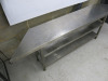 Stainless Steel Table with 2 Shelves Under. Size H73cm x W140cm-210cm x D35cm. NOTE: missing foot. - 2