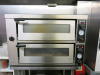 Lincat Twin Deck Electric Pizza Oven, Model A001, S/N 30273580. Size H65 x W96 x D82cm. Comes with Metal Stand. Size H90 x W95 x D80cm & 3 x Pizza Peel.