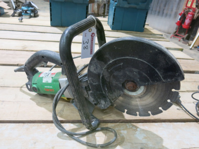 Hitachi CM12Y 110V, 12" Hand Held Saw with Diamond Tipped Blade.
