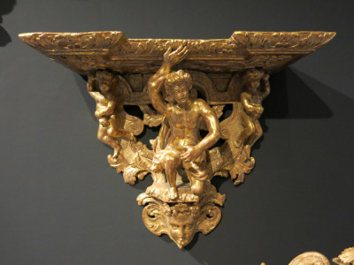 Gold Carved Shelf Bracket, Featuring Man & 2 Cherubs. Size H41 x W49 x D22cm.