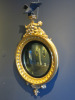 Regency Style Carved Giltwood Convex Mirror with Ebonised Eagle to Top. Size H100 x W55 x D17cm. - 2