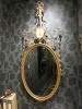 A Carved Wood and Water-Gilt 'Robert Adam' Period "Dressed" Oval Looking-Glass, English, Circa 1790. Size H165 x W73cm.