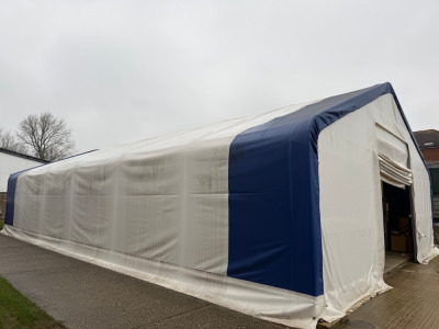 33 x 60 x 17ft Double Trussed Storage Tent with Strong PVC & Galvanised Steel Frame. 13 x 13ft Openings with Hand Braked Winch, Model RPW2200 Shutters. Fitted with Lighting & Power. NOTE: buyer will be required to supply relevant logistics, labour & trans