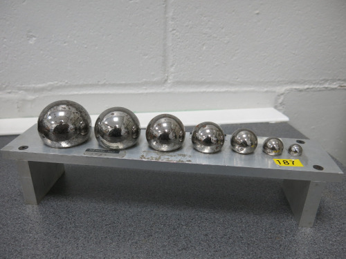 Set of 7 Weighted Steel Calibration Balls on Stand.