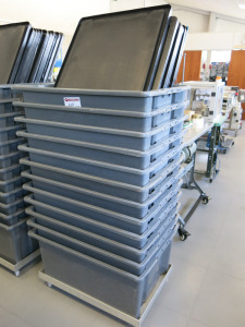 12 x Large Grey Stacking Crates with Black Lids & Set of Castors. Size H36 x W60 x L80cm.