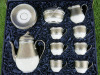 The East India Company Royal Bone China Tong Noon Platinum Hand Painted Tea Set in Presentation Case to Include: 1 x Tea Pot, 1 x Milk Jug, 1 x Sugar Bowl with Lid, 6 x Tea Cups & 6 x Saucers.