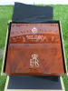 The East India Company Commemorative Queen Elizabeth 70th Jubilee Coin Collectors Box in Polished Wood with Gold Lettering and The Royal Cipher EIIR. Comes with 10 Coin Holder Insert & Pair of White Gloves. Size H9 x W 31 x D30cm.