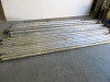 Approx 125 Assorted Pieces of Large Aluminium Scaffold Tower Component Parts to Include: 77 x Assorted Length Brace Bars, 32 x Stabiliser Legs, 9 x Frames, 3 x Stand Platforms & 4 x Trapdoor Platforms. - 12