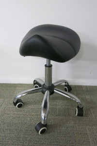 Height Adjustable Black Saddle Massage Stool, with Chrome Legs.
