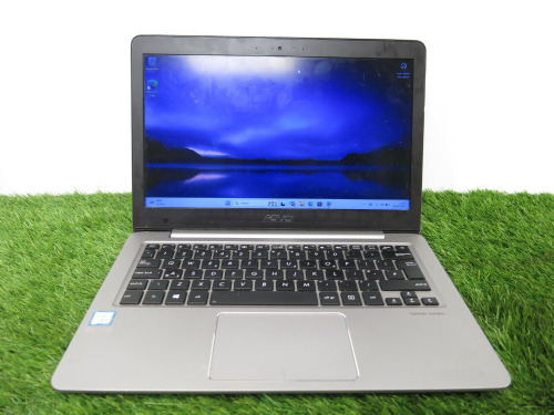 ASUS UX310U Notebook 14" Laptop, Running Windows 11 Pro, Intel Core i7-7500U CPU @ 2.70GHz, 8GB RAM, 238GB SSD, with Power Supply.