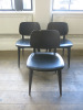 25 x Black Wood Dining Chairs Upholstered in Black Faux Leather, Condition As Viewed/Pictured.