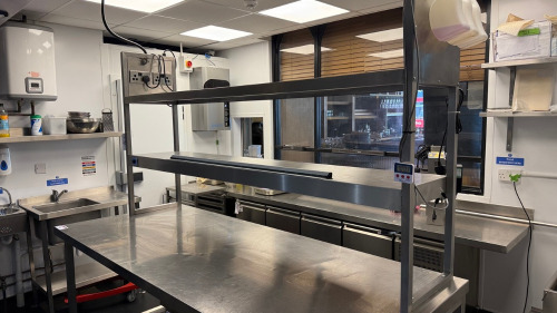 Large Stainless Steel Passthrough Table with Heated Gantry. Overall Size H210 x W220 x D90cm.