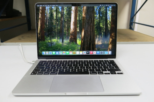 Apple MacBook Air 14", 13.6" Liquid Retina Display, 16GB Memory, 494GB Storage, with Power Supply.