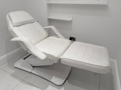 Electric 3 Section Treatment Couch with Arm Attachments.