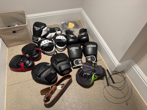 Assorted Boxing Gloves, Pads & Other to Include: 3 x Pairs of Boxing Gloves, 3 x Pairs of Pads, Skipping Rope, Weight Belt & Weightlifting Gloves (As Viewed)