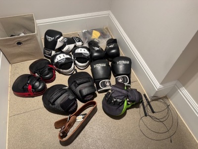 Assorted Boxing Gloves, Pads & Other to Include: 3 x Pairs of Boxing Gloves, 3 x Pairs of Pads, Skipping Rope, Weight Belt & Weightlifting Gloves (As Viewed)
