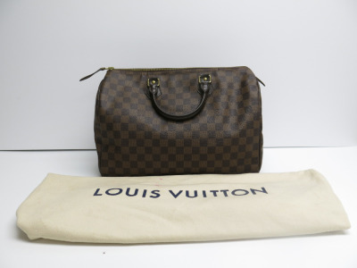 Louis Vuitton Speedy 35 in Damier Ebene Canvas Handbag. Date Code SP0161. Comes with Louis Vuitton Dust Bag.