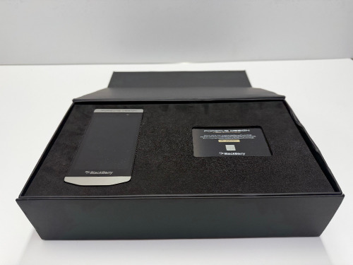 Porsche Design Blackberry Smart Phone, Model P9982. Comes in Original Box with Charger, Plugs, Earphones, Manuals & Authentication Card.
