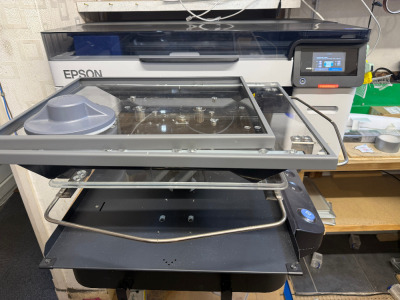 Epson SureColor Direct to Garment Printer, Model SC-F2200. NOTE: Location Welling, Kent. The buyer is responsible for removing from the premises by appointment only, with viewing recommended for logistics.