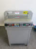 450VS+ Semi-Automatic Electric Paper Cutting Machine on Metal Cabinet.