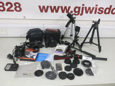 Quantity of Photographic Equipment to Include: 1 x Canon EOS 600D Camera Body with Bag & Instructions, 1 x Petri MF-1 Camera, 5 x Camera Tripods & Poles & Assortement of Caps & Accessories as Viewed/Pictured.
