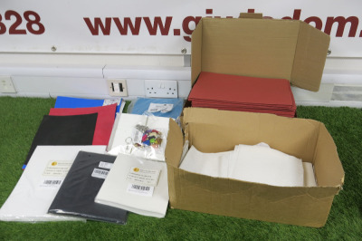Lot of Assorted Materials to Include: Red Paper Folders, Blue Plain Lined Writing Books, Foam Sheets, Stabilizing Sheets & Air Freshener Kit.