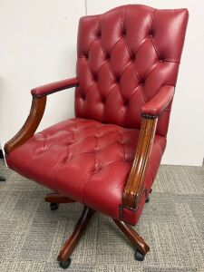Reproduction Faux Oxblood Leather Captains Chair on Swivel Base.