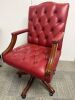 Reproduction Faux Oxblood Leather Captains Chair on Swivel Base.