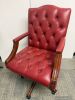 Reproduction Faux Oxblood Leather Captains Chair on Swivel Base. - 2