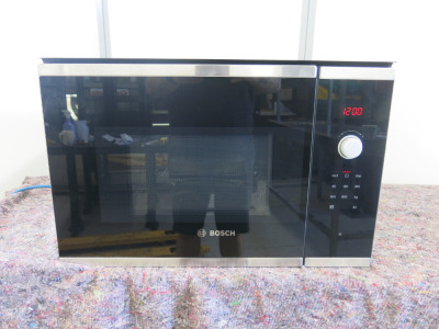Bosch 800W Integrated Microwave, Model BFL523MSOB, S/N 540K593240136241100144. NOTE: appears unused.