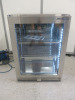 Precision Stainless Steel Single Glass Door Bottle Cooler, Model BBS600, S/N 199124. Size H85 x W60 x D50cm. Comes with Keys & Operating Instructions. NOTE: installed new and appears never used.